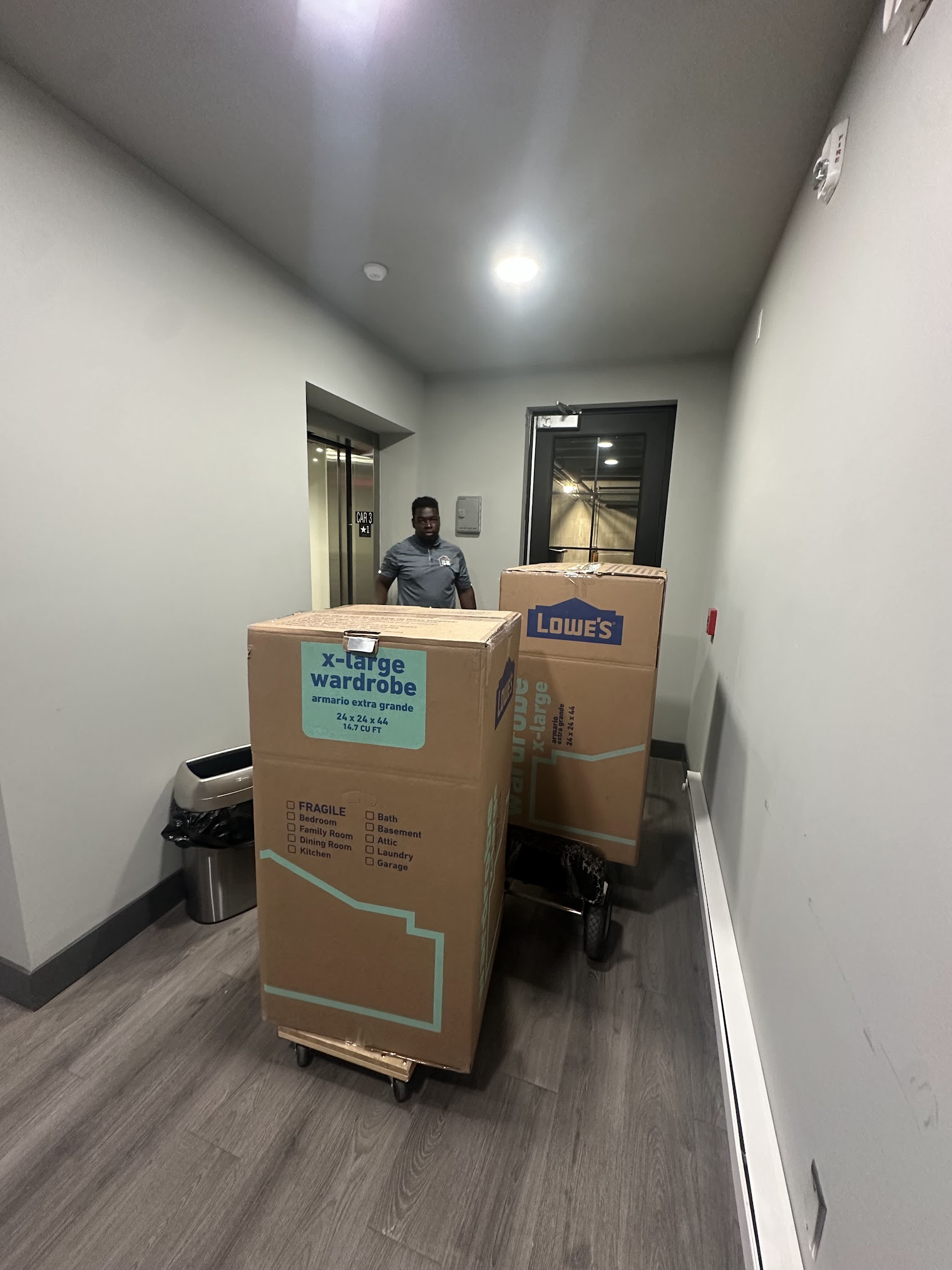 Professional packers wrapping fragile items for a Des Moines move