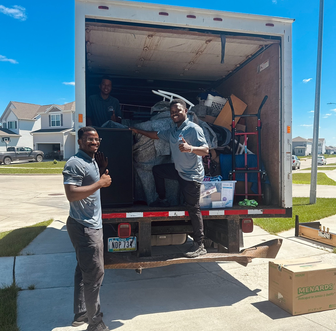 Movers Grimes 1 Midwest Moving Pros crew loading a moving truck at a Grimes Iowa home.